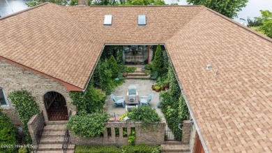 This Mediterranean-style brick home offers panoramic views of on Harbour Point Golf Club in North Carolina - for sale on GolfHomes.com, golf home, golf lot