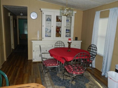 1985 Ventura 26x48 has been updated with double pane windows on Grasslands Golf and Country Club in Florida - for sale on GolfHomes.com, golf home, golf lot