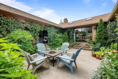 This Mediterranean-style brick home offers panoramic views of on Harbour Point Golf Club in North Carolina - for sale on GolfHomes.com, golf home, golf lot