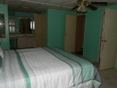 1985 Ventura 26x48 has been updated with double pane windows on Grasslands Golf and Country Club in Florida - for sale on GolfHomes.com, golf home, golf lot