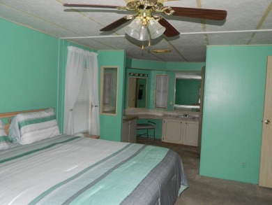 1985 Ventura 26x48 has been updated with double pane windows on Grasslands Golf and Country Club in Florida - for sale on GolfHomes.com, golf home, golf lot
