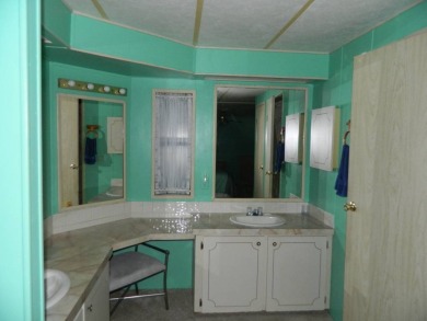 1985 Ventura 26x48 has been updated with double pane windows on Grasslands Golf and Country Club in Florida - for sale on GolfHomes.com, golf home, golf lot