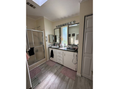 This spacious residence of 2 bedroom features oasis landscaping on Schalamar Creek Golf and Country Club in Florida - for sale on GolfHomes.com, golf home, golf lot