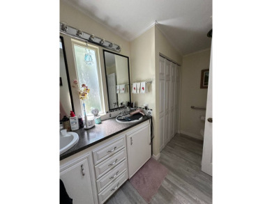 This spacious residence of 2 bedroom features oasis landscaping on Schalamar Creek Golf and Country Club in Florida - for sale on GolfHomes.com, golf home, golf lot