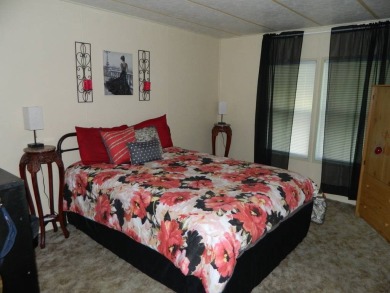 1985 Ventura 26x48 has been updated with double pane windows on Grasslands Golf and Country Club in Florida - for sale on GolfHomes.com, golf home, golf lot