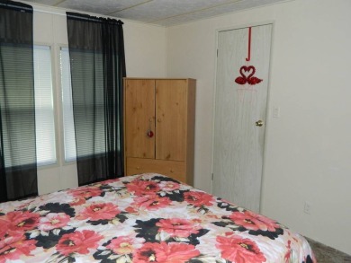 1985 Ventura 26x48 has been updated with double pane windows on Grasslands Golf and Country Club in Florida - for sale on GolfHomes.com, golf home, golf lot