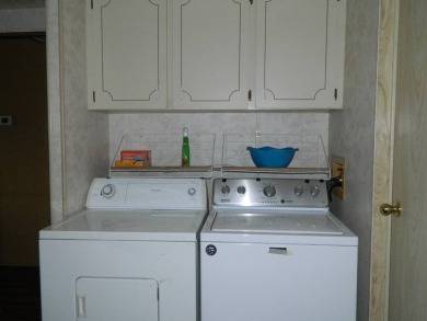 1985 Ventura 26x48 has been updated with double pane windows on Grasslands Golf and Country Club in Florida - for sale on GolfHomes.com, golf home, golf lot