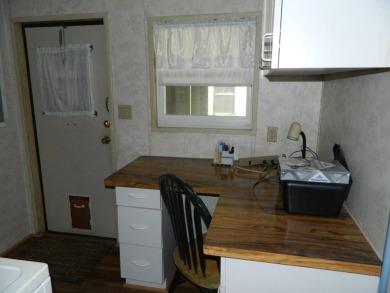1985 Ventura 26x48 has been updated with double pane windows on Grasslands Golf and Country Club in Florida - for sale on GolfHomes.com, golf home, golf lot