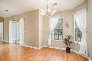 Elegant Ranch-Style Home with Serene Pond Views--Minutes from on Sandpiper Bay Golf and Country Club in North Carolina - for sale on GolfHomes.com, golf home, golf lot