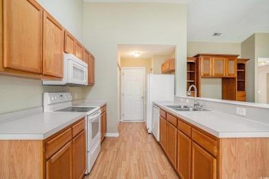 Elegant Ranch-Style Home with Serene Pond Views--Minutes from on Sandpiper Bay Golf and Country Club in North Carolina - for sale on GolfHomes.com, golf home, golf lot