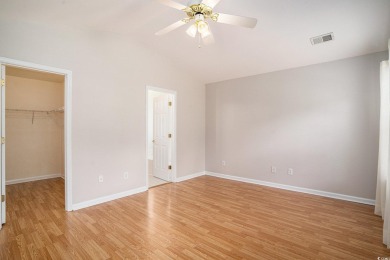 Elegant Ranch-Style Home with Serene Pond Views--Minutes from on Sandpiper Bay Golf and Country Club in North Carolina - for sale on GolfHomes.com, golf home, golf lot