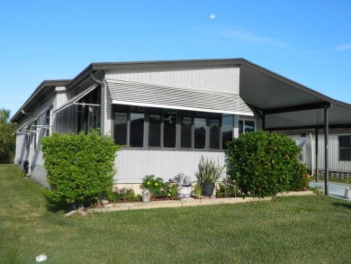1985 Ventura 26x48 has been updated with double pane windows on Grasslands Golf and Country Club in Florida - for sale on GolfHomes.com, golf home, golf lot