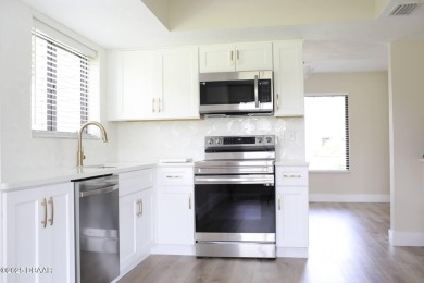LUXURY IN GATED GOLF COMMUNITY - 3BR/2BA END UNIT | 128-B Golden on The Club At Pelican Bay - North Course in Florida - for sale on GolfHomes.com, golf home, golf lot