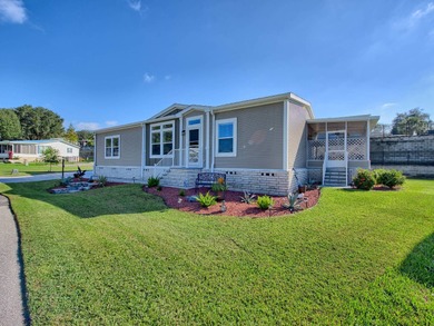 This Blue Coral model has a WATER VIEW from every room in the on Water Oak Country Club Estates in Florida - for sale on GolfHomes.com, golf home, golf lot