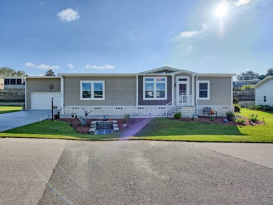 This Blue Coral model has a WATER VIEW from every room in the on Water Oak Country Club Estates in Florida - for sale on GolfHomes.com, golf home, golf lot