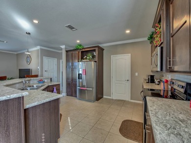 This Blue Coral model has a WATER VIEW from every room in the on Water Oak Country Club Estates in Florida - for sale on GolfHomes.com, golf home, golf lot