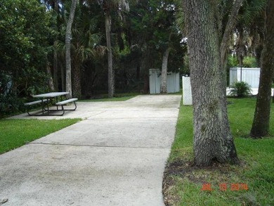 Beautiful concrete RV Lot snuggled in wooded area of Oak Cove on The Great Outdoors Golf and Country Club in Florida - for sale on GolfHomes.com, golf home, golf lot