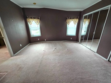 This home is on leased land and is located in a 55+ resort-style on Big Cypress Golf and Country Club in Florida - for sale on GolfHomes.com, golf home, golf lot