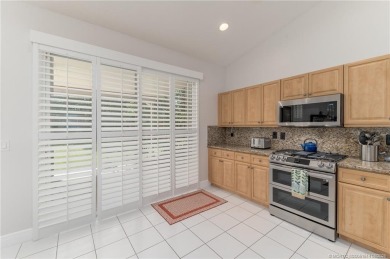 Charming Oasis in Ballantrae! Step inside this Light and Bright on Santa Lucia River Club in Florida - for sale on GolfHomes.com, golf home, golf lot