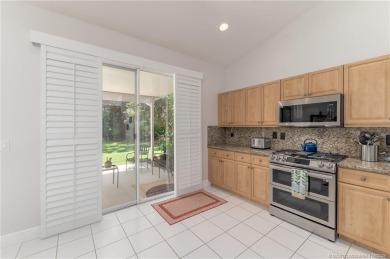 Charming Oasis in Ballantrae! Step inside this Light and Bright on Santa Lucia River Club in Florida - for sale on GolfHomes.com, golf home, golf lot