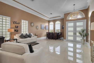 Nestled within the sought-after Aberdeen Golf & Country Club on Aberdeen Golf and Country Club in Florida - for sale on GolfHomes.com, golf home, golf lot