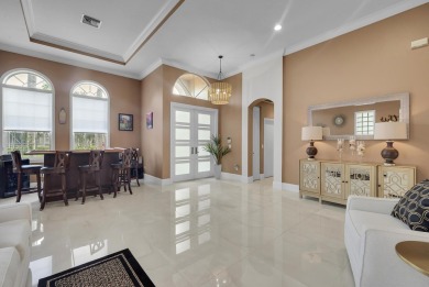 Nestled within the sought-after Aberdeen Golf & Country Club on Aberdeen Golf and Country Club in Florida - for sale on GolfHomes.com, golf home, golf lot