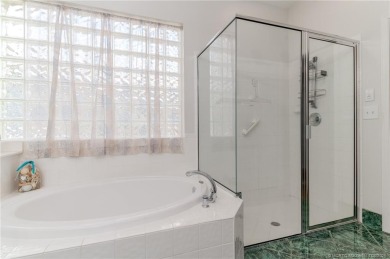 Charming Oasis in Ballantrae! Step inside this Light and Bright on Santa Lucia River Club in Florida - for sale on GolfHomes.com, golf home, golf lot