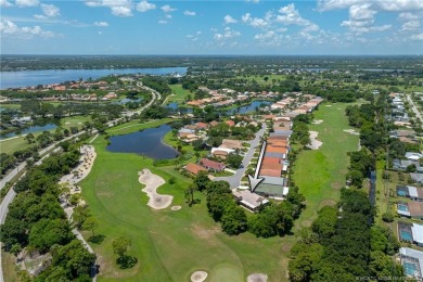 Charming Oasis in Ballantrae! Step inside this Light and Bright on Santa Lucia River Club in Florida - for sale on GolfHomes.com, golf home, golf lot