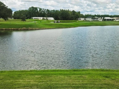 This home is on leased land and is located in a 55+ resort-style on Big Cypress Golf and Country Club in Florida - for sale on GolfHomes.com, golf home, golf lot