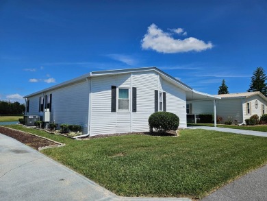 This home is on leased land and is located in a 55+ resort-style on Big Cypress Golf and Country Club in Florida - for sale on GolfHomes.com, golf home, golf lot