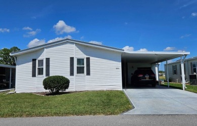 This home is on leased land and is located in a 55+ resort-style on Big Cypress Golf and Country Club in Florida - for sale on GolfHomes.com, golf home, golf lot