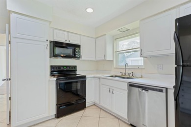 Very charming Classic Florida Coastal Ranch home with 3 bedrooms on Palm Harbor Golf Club in Florida - for sale on GolfHomes.com, golf home, golf lot