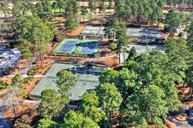 This immaculate two-bedroom townhome in Woodside offers on Woodside Plantation Country Club in South Carolina - for sale on GolfHomes.com, golf home, golf lot