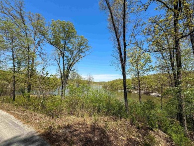 Lakefront lot on the peaceful shores of Lake Aztec in Cherokee on Cherokee Village South Course in Arkansas - for sale on GolfHomes.com, golf home, golf lot