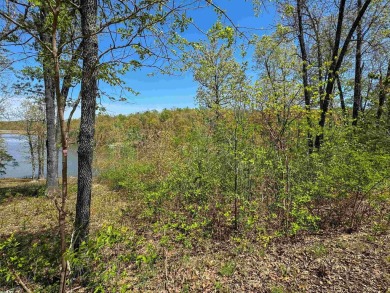Lakefront lot on the peaceful shores of Lake Aztec in Cherokee on Cherokee Village South Course in Arkansas - for sale on GolfHomes.com, golf home, golf lot