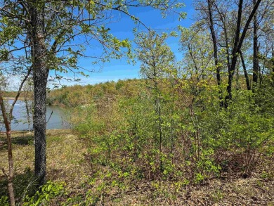 Lakefront lot on the peaceful shores of Lake Aztec in Cherokee on Cherokee Village South Course in Arkansas - for sale on GolfHomes.com, golf home, golf lot