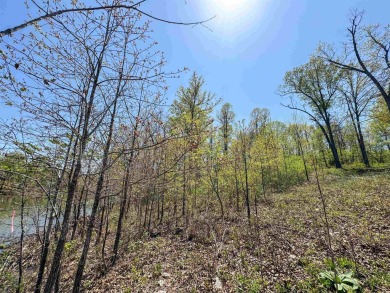 Lakefront lot on the peaceful shores of Lake Aztec in Cherokee on Cherokee Village South Course in Arkansas - for sale on GolfHomes.com, golf home, golf lot