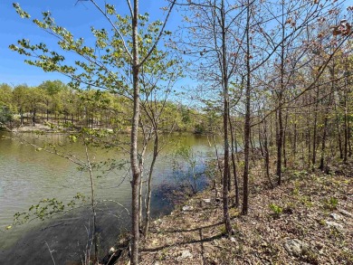 Lakefront lot on the peaceful shores of Lake Aztec in Cherokee on Cherokee Village South Course in Arkansas - for sale on GolfHomes.com, golf home, golf lot