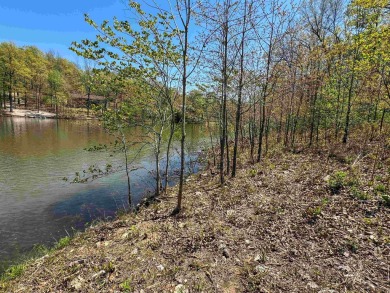 Lakefront lot on the peaceful shores of Lake Aztec in Cherokee on Cherokee Village South Course in Arkansas - for sale on GolfHomes.com, golf home, golf lot