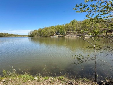 Lakefront lot on the peaceful shores of Lake Aztec in Cherokee on Cherokee Village South Course in Arkansas - for sale on GolfHomes.com, golf home, golf lot