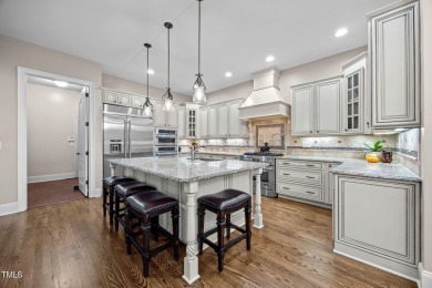 This spacious 6,785 square foot home with 5 bedrooms, 5 full on Hasentree Club in North Carolina - for sale on GolfHomes.com, golf home, golf lot