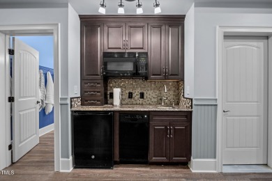 This spacious 6,785 square foot home with 5 bedrooms, 5 full on Hasentree Club in North Carolina - for sale on GolfHomes.com, golf home, golf lot