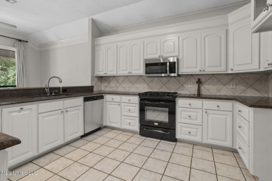 This beautifully maintained 3 bedroom, 2 bath home offers golf on Colonial Country Club Deerfield in Mississippi - for sale on GolfHomes.com, golf home, golf lot