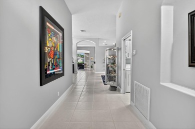 Experience lakefront living at it finest in this immaculate on Gleneagles Golf and Country Club in Florida - for sale on GolfHomes.com, golf home, golf lot