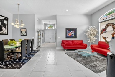 Experience lakefront living at it finest in this immaculate on Gleneagles Golf and Country Club in Florida - for sale on GolfHomes.com, golf home, golf lot