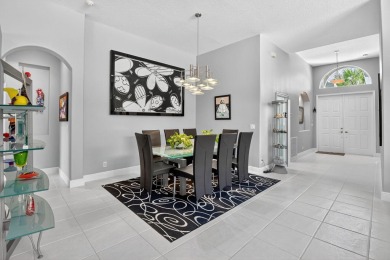 Experience lakefront living at it finest in this immaculate on Gleneagles Golf and Country Club in Florida - for sale on GolfHomes.com, golf home, golf lot