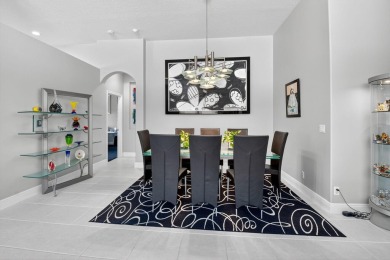 Experience lakefront living at it finest in this immaculate on Gleneagles Golf and Country Club in Florida - for sale on GolfHomes.com, golf home, golf lot