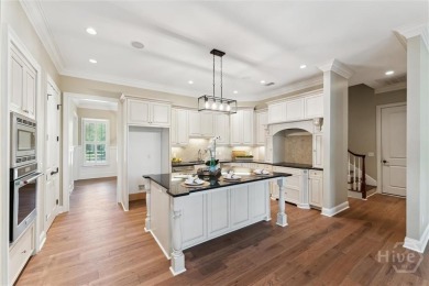 Step into timeless elegance in this beautifully crafted brick on Savannah Quarters Country Club in Georgia - for sale on GolfHomes.com, golf home, golf lot