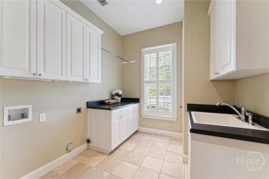 Step into timeless elegance in this beautifully crafted brick on Savannah Quarters Country Club in Georgia - for sale on GolfHomes.com, golf home, golf lot