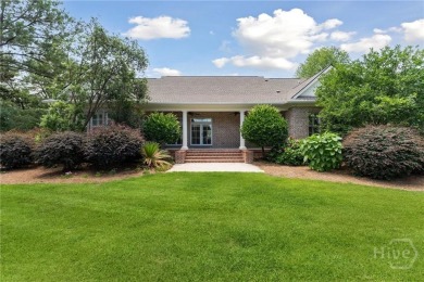 Step into timeless elegance in this beautifully crafted brick on Savannah Quarters Country Club in Georgia - for sale on GolfHomes.com, golf home, golf lot